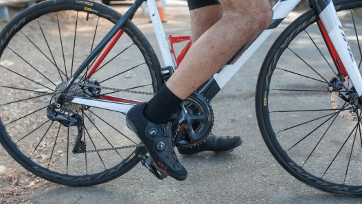a cyclist wearing a clipless shoe