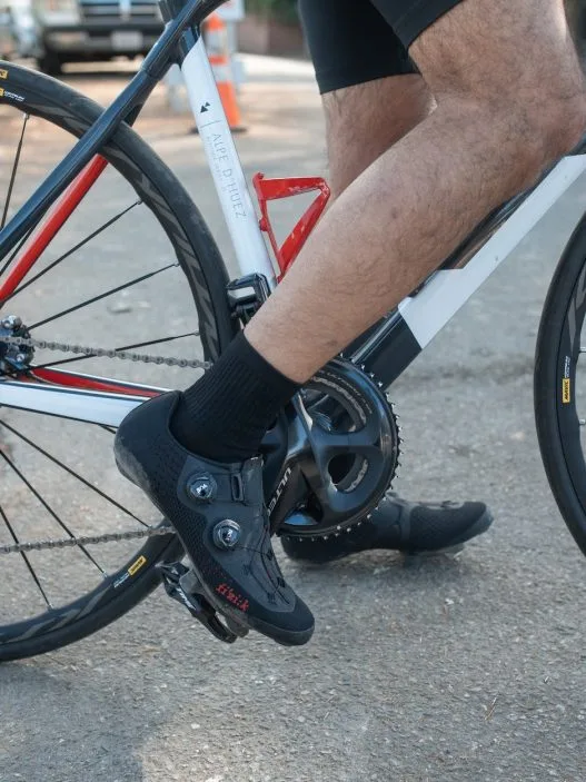a cyclist wearing a clipless shoe